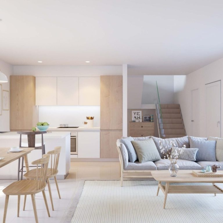 Sala de estar moderna con cocina abierta, muebles de madera y decoración minimalista.