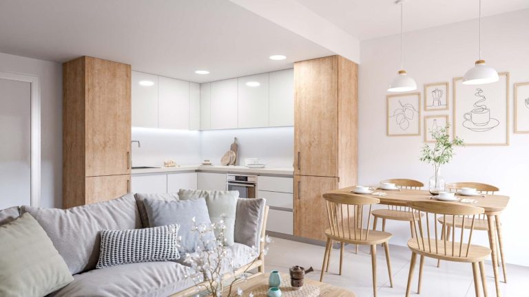 Cocina moderna con muebles de madera clara y zona de comedor minimalista.